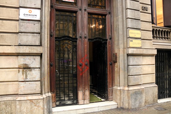 A painted swastika is visible on the door of the Òmnium HQ in Barcelona on November 26 2018 (Núria Julià)